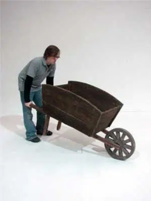 20080317142926_Wooden-Wheelbarrow-and-person-(Medium)